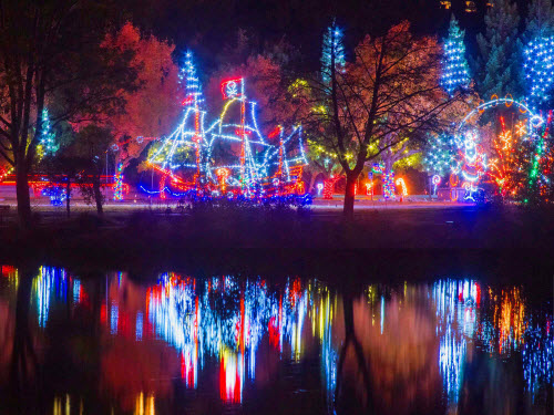 far shot of the LED pirate ship being reflected in the water