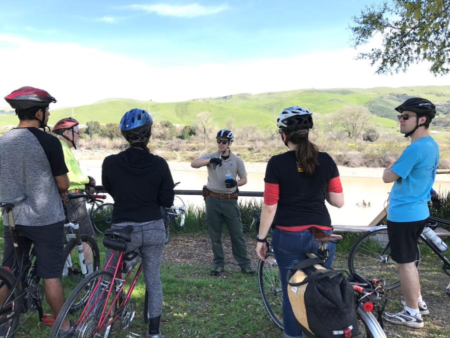A Park Interpreter talking to participants on a guided bike ride program