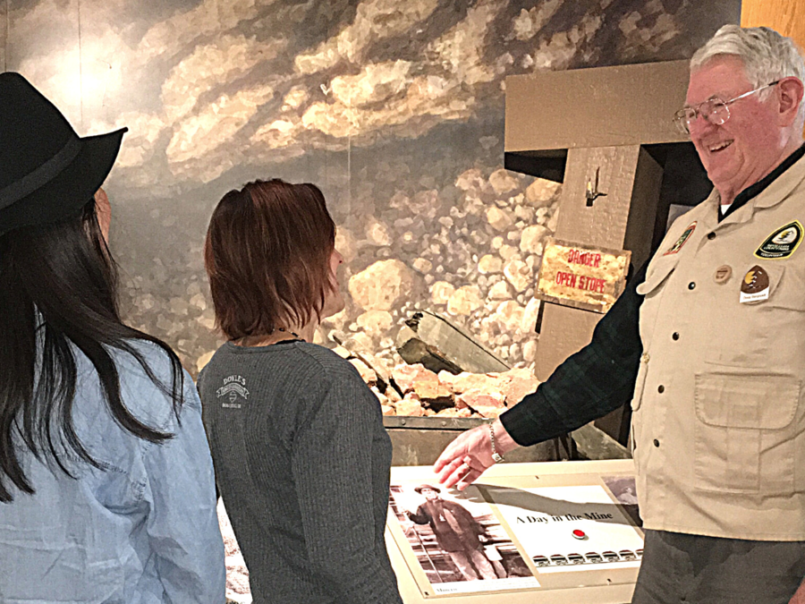Almaden Quicksilver museum hosts talking to visitors. 