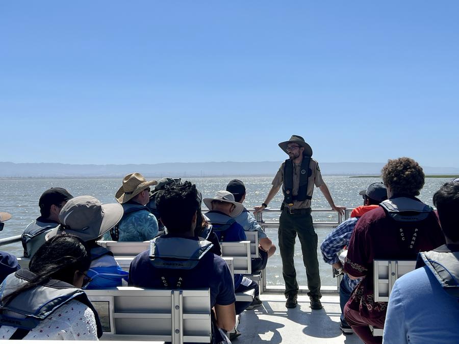 Program on Alviso boat with speaker and audience