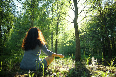 Image of Human meditating in the forest