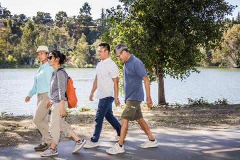 Adult family strolls along Vasona Lake