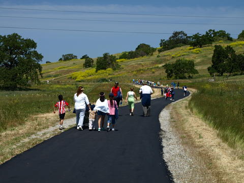 People walking along the paved Martin Murphy trail