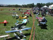An open field with model airplanes