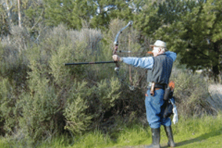 An archer shooting a bow and arrow